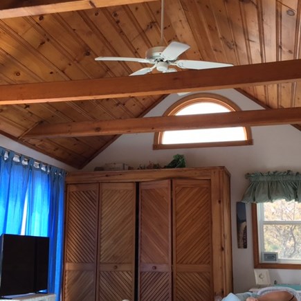 Wellfleet Oceanfront Home Cape Cod vacation rental - Master Bedroom, warm wood, beams, ceiling fan
