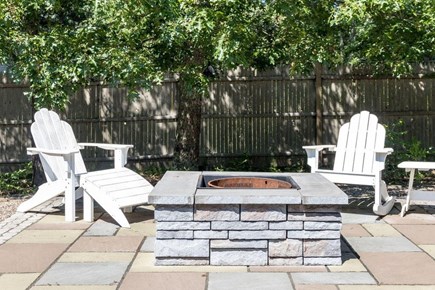Harwich Cape Cod vacation rental - Private back yard with BBQ grill, fire pit and outdoor shower