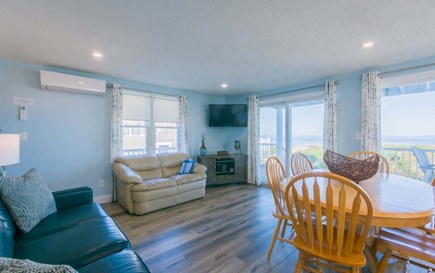 East Sandwich Cape Cod vacation rental - Living area with TV and mini split A/C - 1st Floor.