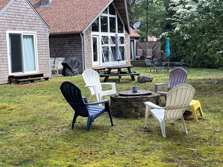 Brewster Cape Cod vacation rental - Large private backyard. Firepit, grill, outdoor tables.