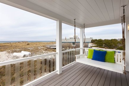 Truro Cape Cod vacation rental - Porch swing off primary bedroom on first floor