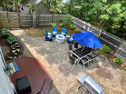 North Eastham Cape Cod vacation rental - Fenced in yard-patio/hammock/table/fire table/Adirondack/gardens!