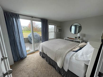 Chatham; Chatham Oceanfront Co Cape Cod vacation rental - 1st floor bedroom w queen bed, A/C and slider to patio.