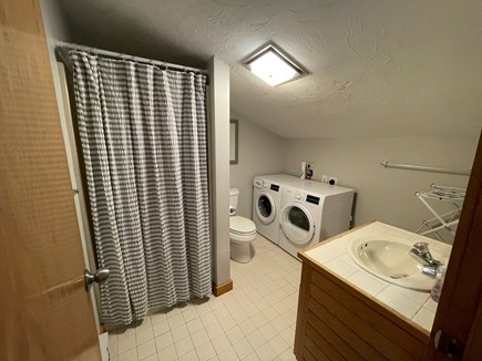 Chatham; Chatham Oceanfront Co Cape Cod vacation rental - Loft bathroom w shower, washer & dryer.