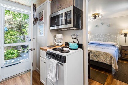 Dennis Port Cape Cod vacation rental - Kitchen leading to back patio
