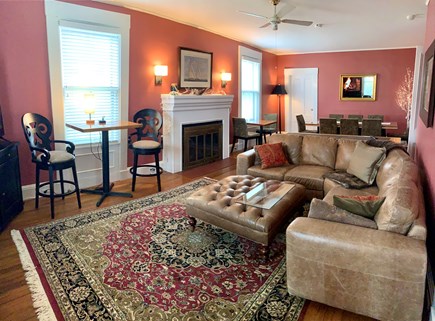 Falmouth Village Cape Cod vacation rental - Living room area with sofa, fireplace, large smart TV