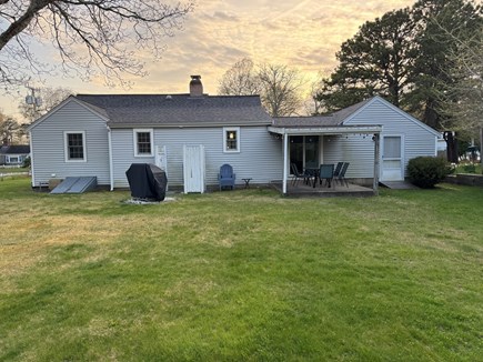 South Yarmouth Cape Cod vacation rental - Huge backyard with great outdoor eating space w/outdoor shower.