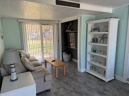 South Yarmouth Cape Cod vacation rental - TV Room w/ a slider door to the backyard