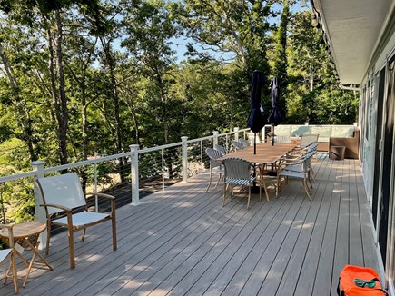 Brewster Cape Cod vacation rental - Deck, facing Sheep Pond, with two tables and sofa