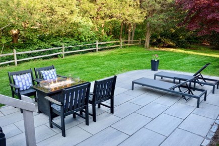 East Orleans Cape Cod vacation rental - New slate patio with gas fire pit and chaises