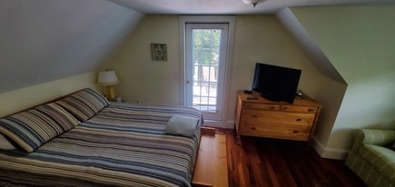 Eastham Cape Cod vacation rental - Queen Bedroom with french door to upper level deck