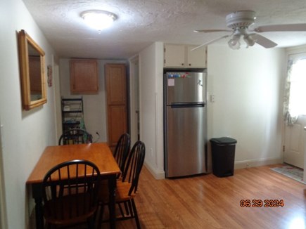 West Yarmouth Cape Cod vacation rental - Spacious Kitchen with seating. Backdoor opens to fenced yard.