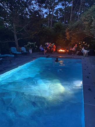 Eastham Cape Cod vacation rental - Poolside fire pit at night