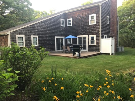 Brewster Cape Cod vacation rental - Private back yard with patio deck and outdoor shower.