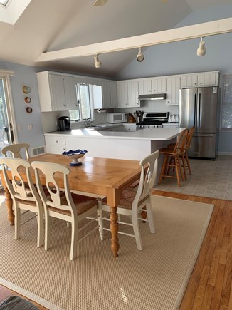 Chatham Cape Cod vacation rental - Dining area looking into kitchen w/ breakfast bar