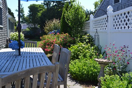 Falmouth Cape Cod vacation rental - Outdoor dining table in the garden