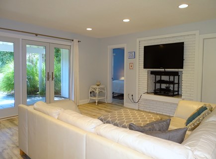 Mashpee, New Seabury Cape Cod vacation rental - First floor living area with TV, slider to driveway