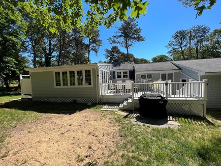 Yarmouthport  Cape Cod vacation rental - Deck table chairs, yard w/outdoor shower. Adirondack chairs/pit