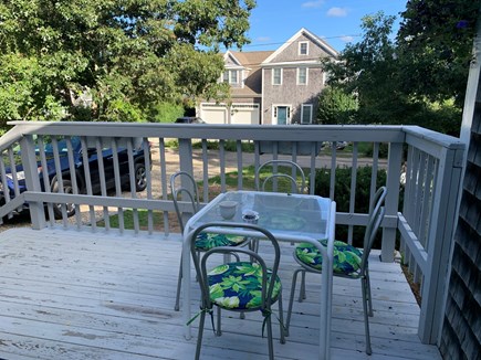 Brewster Cape Cod vacation rental - Front porch with 4 new chairs, new paint, rug and deck chairs.