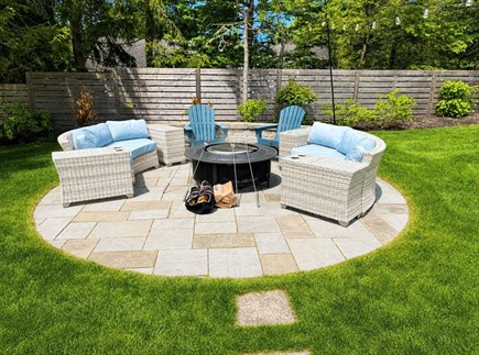 Harwich Cape Cod vacation rental - Backyard patio with fire pit, perfect for evening s'more's