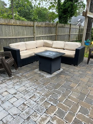 Harwichport Cape Cod vacation rental - Patio with Fire Pit.  Adjacent to deck and swings