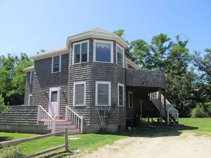 Brewster, Pineland Park Cape Cod vacation rental - Front view, large windows and deck face the bay