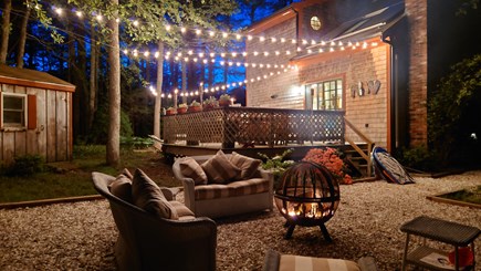 South Eastham Min to Bike Path Cape Cod vacation rental - Shimmery lights & glowing firepit just below upper deck.