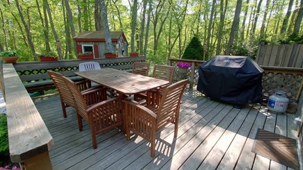 South Eastham Min to Bike Path Cape Cod vacation rental - Acaia 6-seat dining table on shady, private deck with gas grill