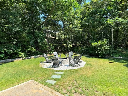 Eastham Cape Cod vacation rental - Stone firepit with quality Adirondack chairs