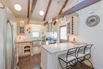 Eastham Cape Cod vacation rental - Fully stocked kitchen with bar stools.