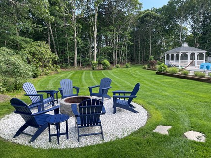 Eastham Cape Cod vacation rental - Large backyard with firepit for the evening smores moments