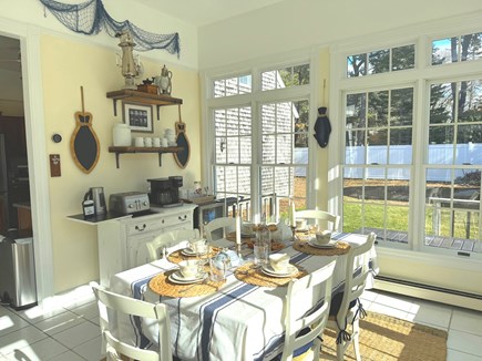 Eastham Cape Cod vacation rental - Bright sunroom with coffee corner and breakfast table.