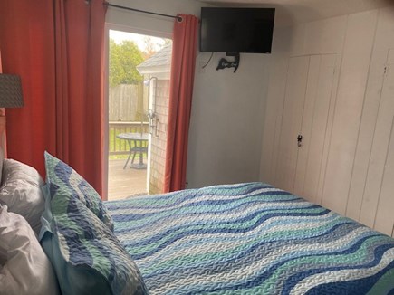Dennis Port Cape Cod vacation rental - Queen bedroom, with smart tv. Slider to deck