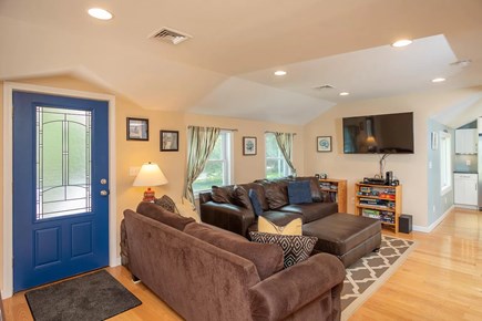 Eastham Cape Cod vacation rental - Living area with TV, games, two sofas, and more