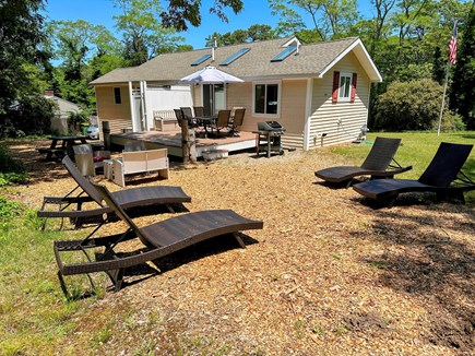 Eastham Cape Cod vacation rental - Ample seating in the private, wooded backyard