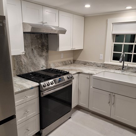 Dennis Cape Cod vacation rental - Farmhouse sink, gas stove, refrigerator, and dishwasher