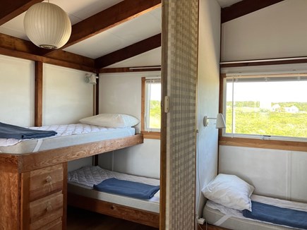 Truro Cape Cod vacation rental - Two bunkbeds on each side. Divided by accordian divider curtain.