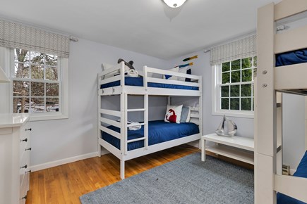 Dennis Cape Cod vacation rental - Main floor bunk room (4 twin beds) has dresser and closet.