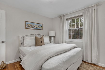 Dennis Cape Cod vacation rental - Main floor bedroom with Queen bed has dresser, mirror and closet.