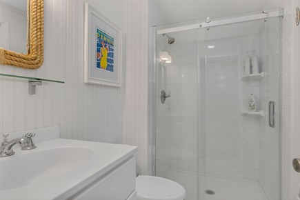 Dennis Cape Cod vacation rental - Master bathroom with walk in shower and glass door.