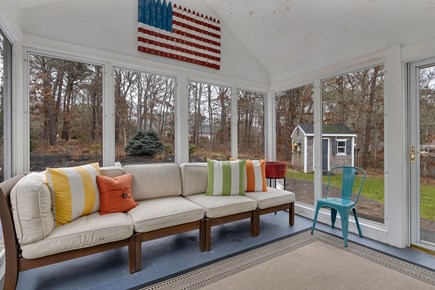 Dennis Cape Cod vacation rental - Three season room off main living area opens to the backyard.