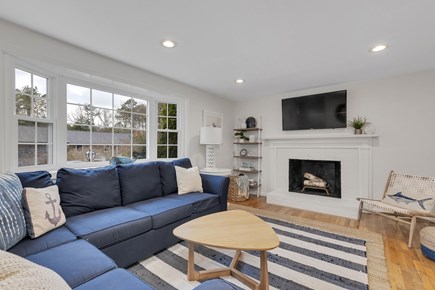 Dennis Cape Cod vacation rental - Living room with wood burning fireplace.
