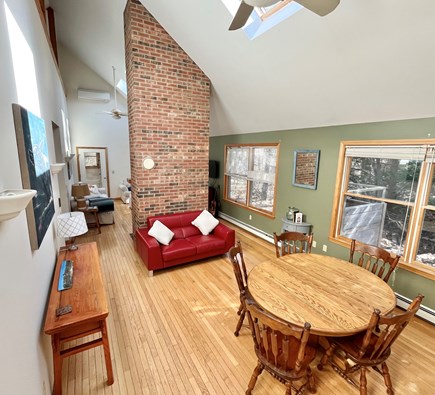 Wellfleet  Cape Cod vacation rental - High ceilings and dramtic expsosed fireplace.