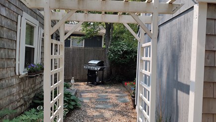 Yarmouth Cape Cod vacation rental - Large propane barbecue grill in the backyard.