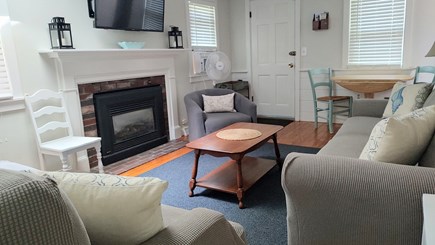 Yarmouth Cape Cod vacation rental - Living room with AC, tv, and a dining table that can seat 4-