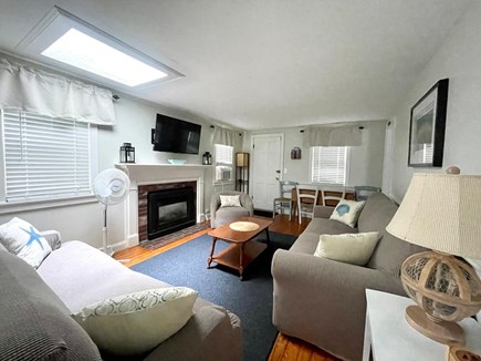 Yarmouth Cape Cod vacation rental - A large flat-screen tv and a dining table that can seat 4-5
