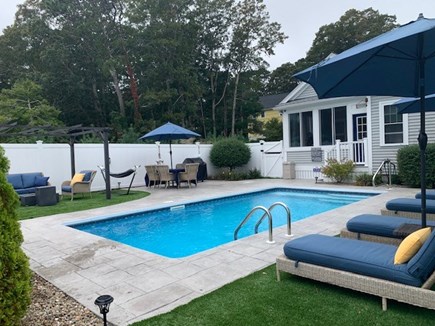 Sagamore Beach Cape Cod vacation rental - Pool area with view of Firepit, BBQ Dining Area, Hammock