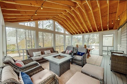 Eastham Cape Cod vacation rental - Large screened porch with propane fire tableand patio furniture