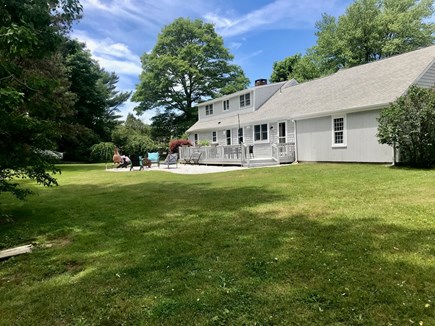 East Falmouth Cape Cod vacation rental - Large backyard with firepit & hammock. Great for lawn games!