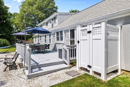 East Falmouth Cape Cod vacation rental - A view of the back deck and new outdoor shower.
